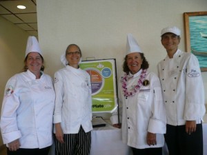 Chefs with MyPlate Sign