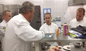 National Team Members reviewing cuts of meat.