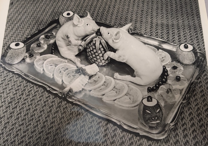 Two pigs on a tray.