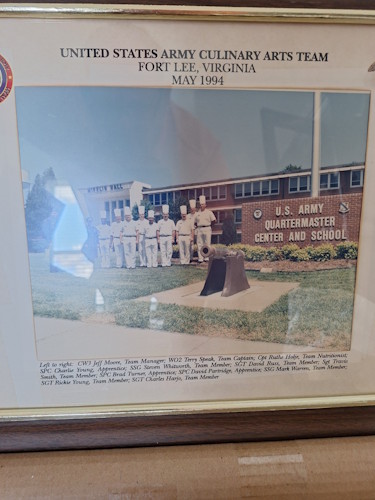 A framed picture of a group of soldiers.