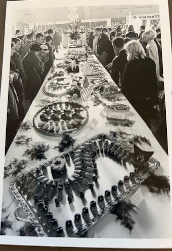 A long table with food on it.