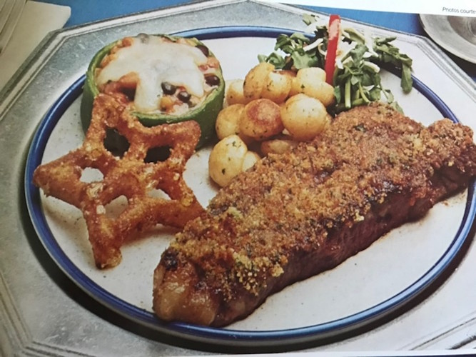 A plate of food on a blue and white plate.