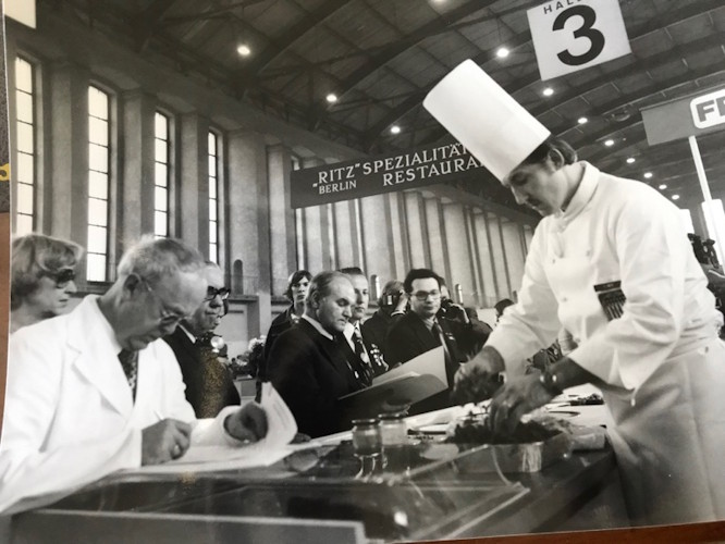 A chef in a white coat.