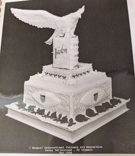 A black and white photo of a cake.