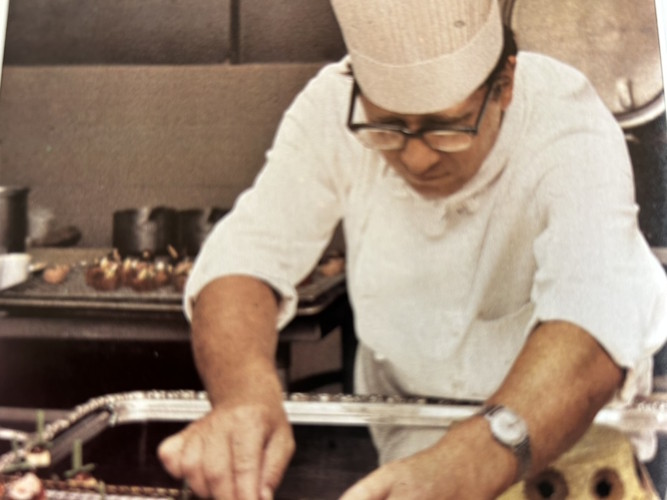 A person in a chef's hat.